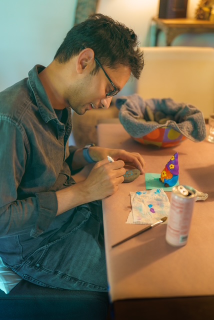 Person painting at a creative gathering