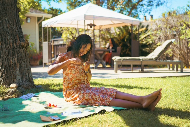 A quiet afternoon on a blanket under a tree