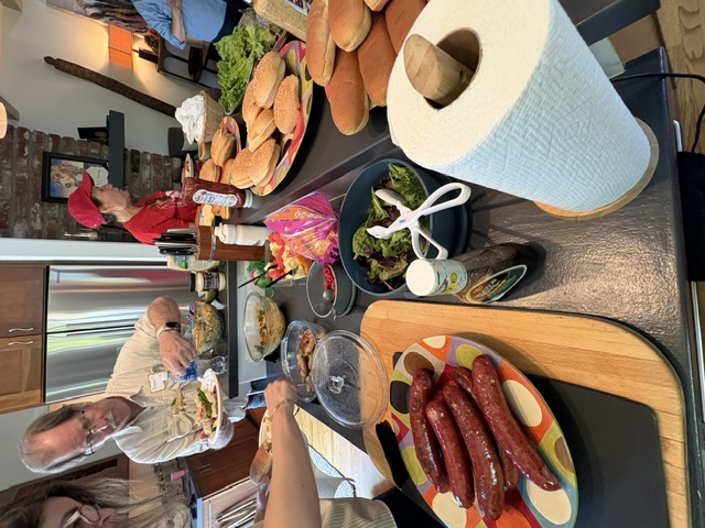 Friends sharing a potluck spread of food